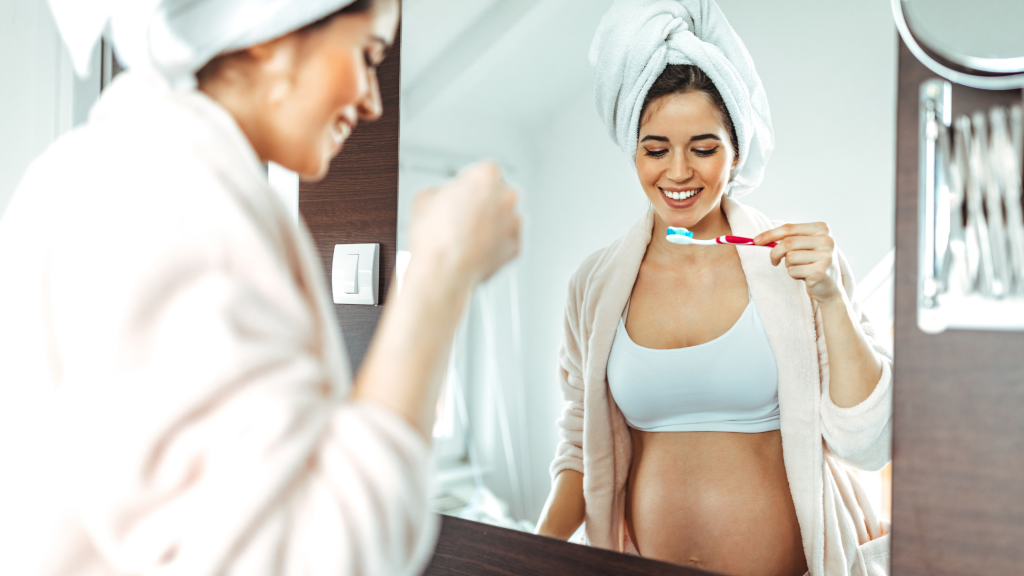 maternity doctors and pregnant woman brushing teeth