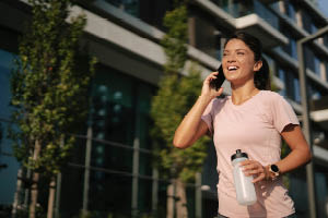 Woman carrying groceries and walking with purpose