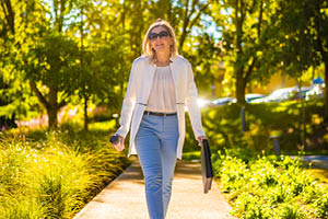 woman carrying groceries and walking with purpose