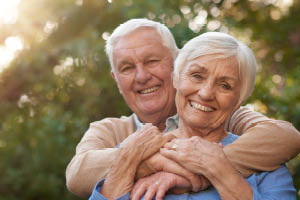 Older couple walking together on a paved trail on a fall morning in Wright County Minnesota